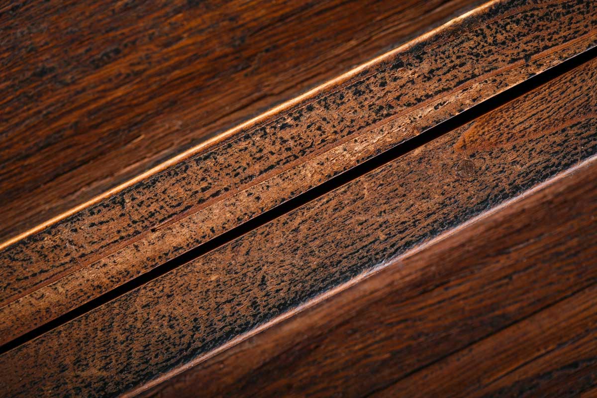 Detailed Close Up Of Dark Stained Wood Flooring